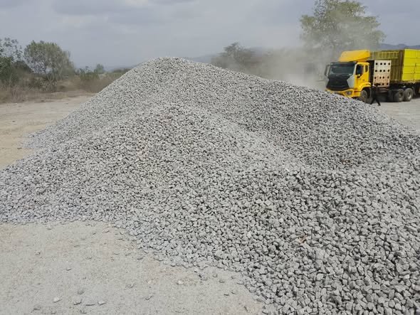 Limestone stockpile with haulage truck